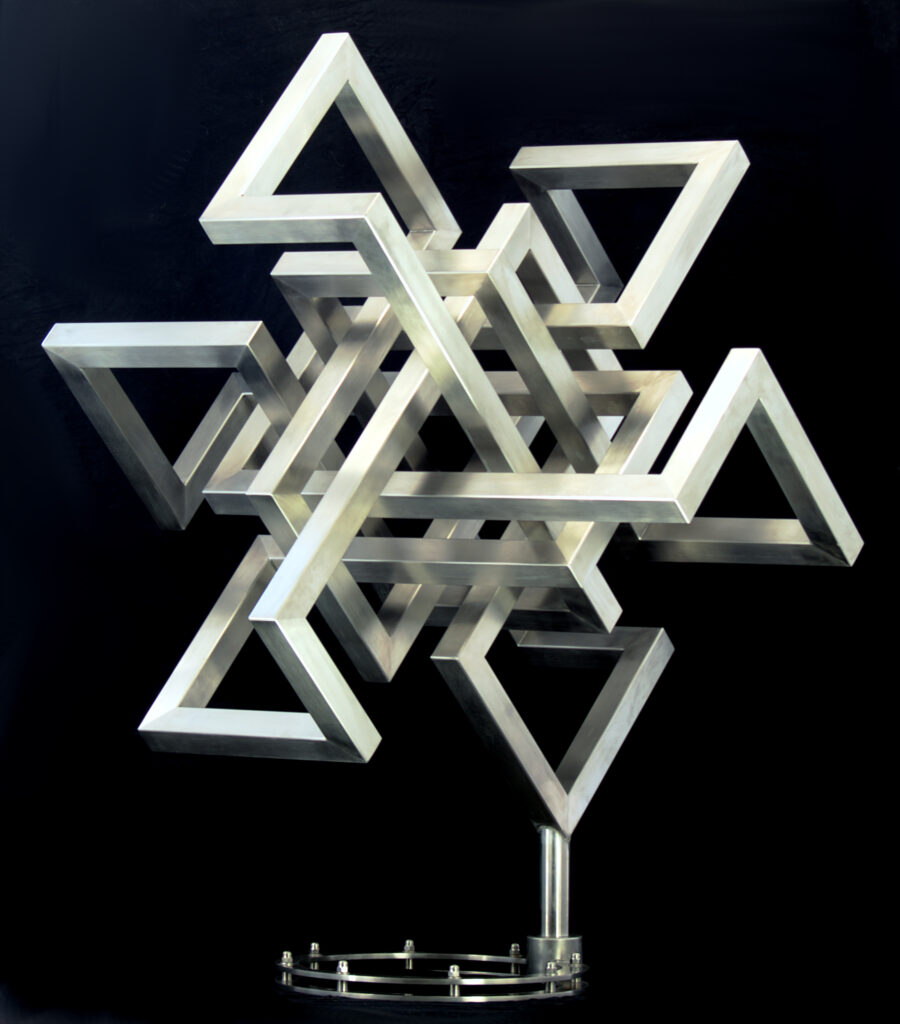 Stainless steel sculpture “Double³”, interlocking geometric structure composed of angular triangular elements, mounted on a circular metal base.